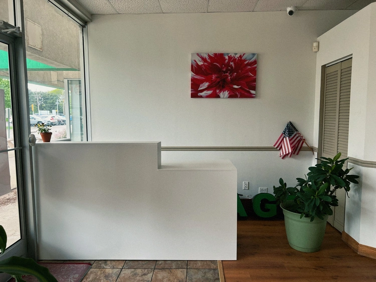 Modern reception counter where guests check in at Thanks Spa